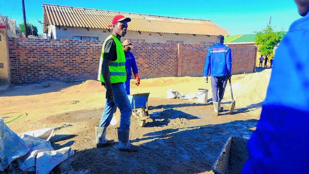Construction team preparing and coordinating concrete works on site